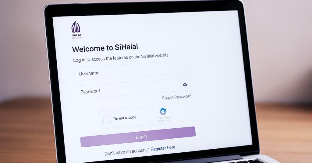 Laptopskärm som visar den officiella sihalal-webbplatsens inloggningssida för ansökan om halal-certifiering i Indonesien.