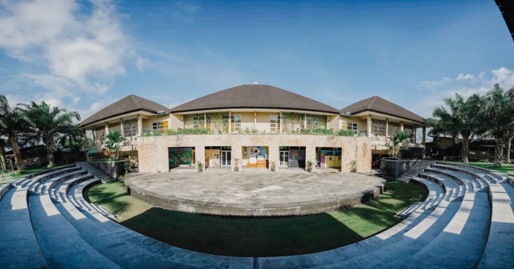 Circular amphitheater courtyard at canggu community school with a wide open learning space and surrounding classrooms.