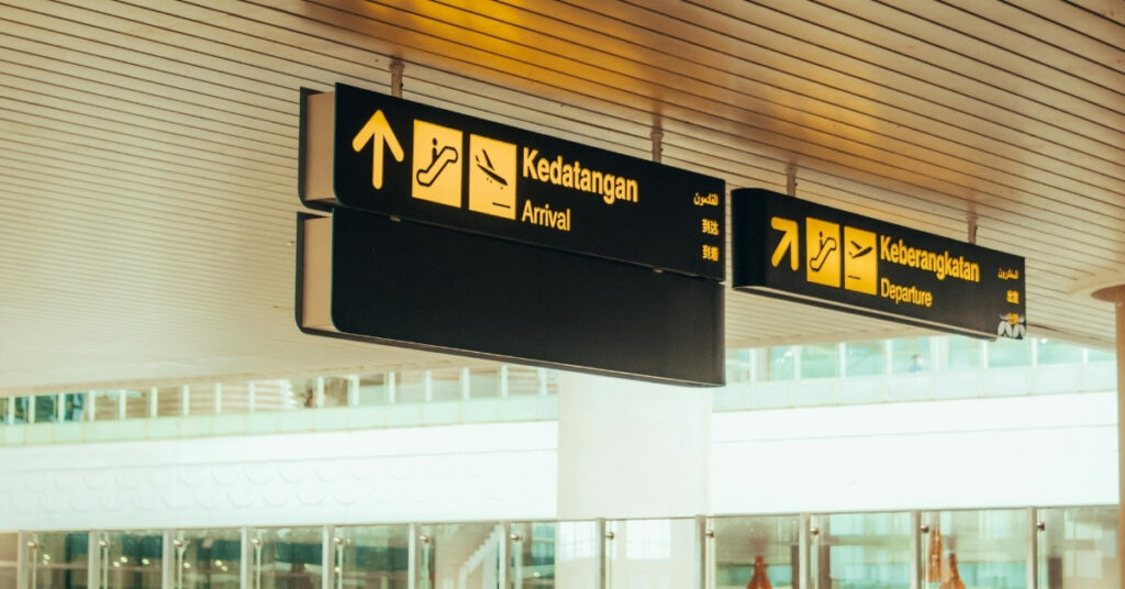 Airport arrival signboard with “kedatangan” (arrival) and “keberangkatan” (departure) directions in indonesia.