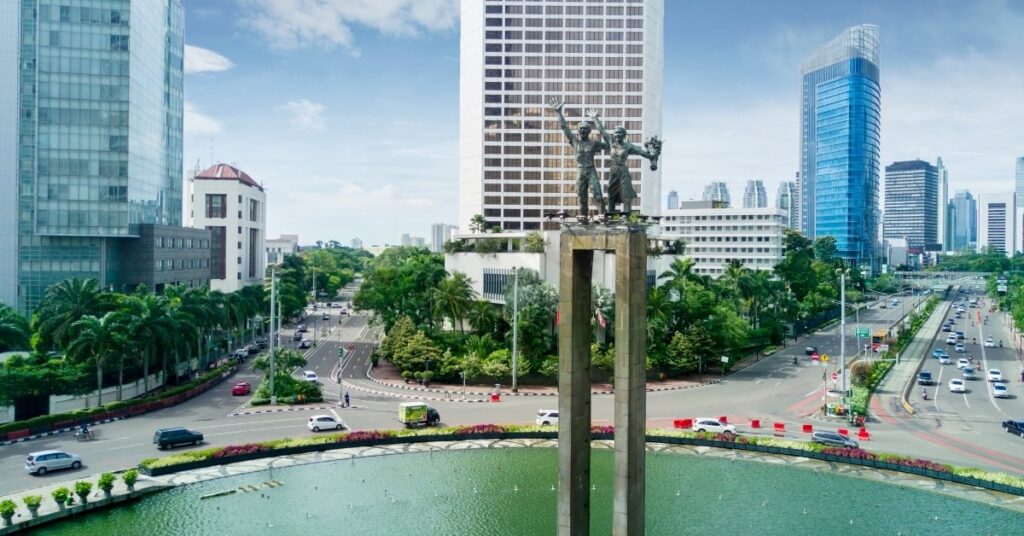 Aerial view of jakarta welcome monument and city skyline, showing what it’s like to live in jakarta, indonesia as an international student