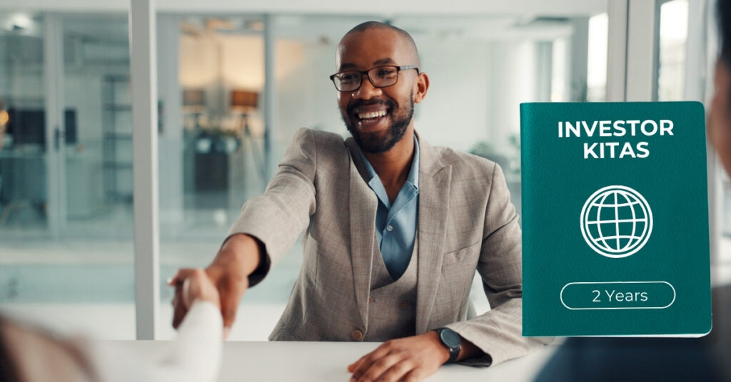 Business professional shaking hands in an office beside an investor kitas graphic marked 2 years, representing bali stay options for investors.