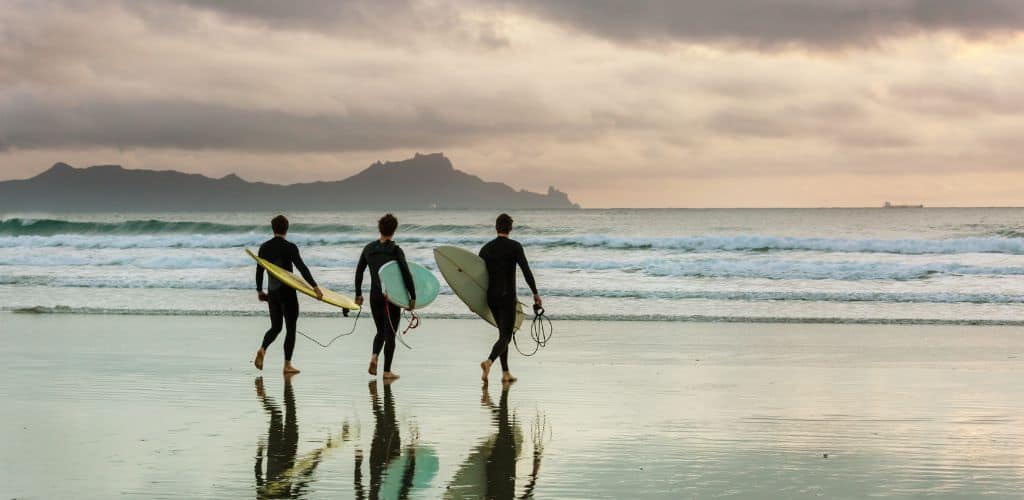 Tourists go surfing in bali