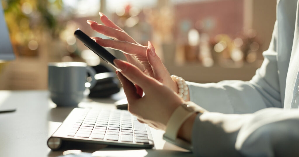 Checking visa advice on a smartphone, risk of trusting unofficial social media posts about Indonesia Visa on Arrival.