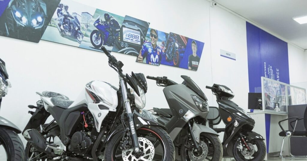 Bali scooter rental shop with yamaha motorbikes and scooters lined up indoors, where to rent a scooter in bali.