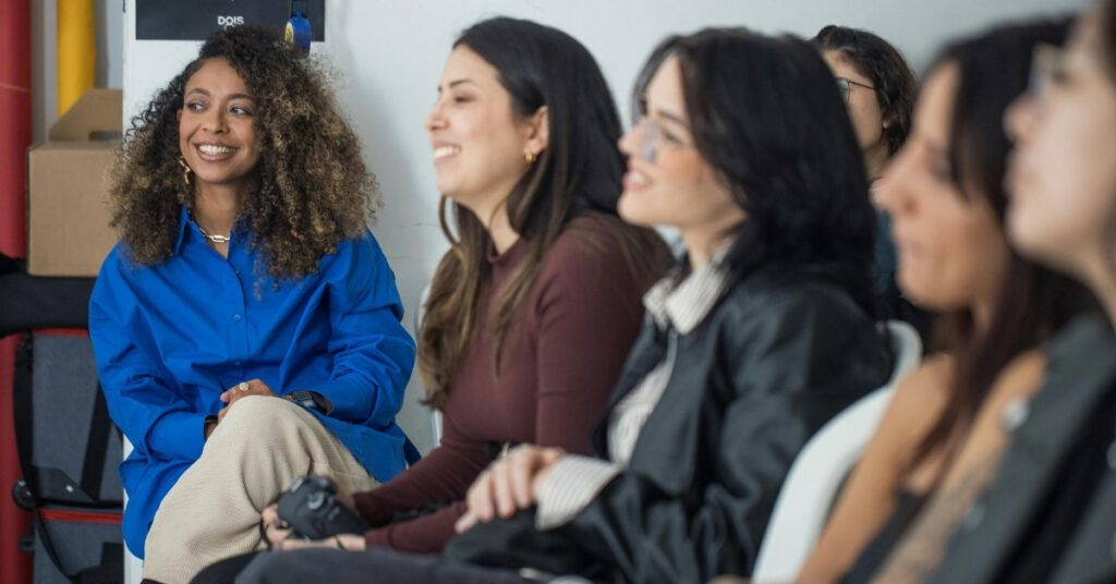 Group of women sitting together in a applying for address mutation in immigration office