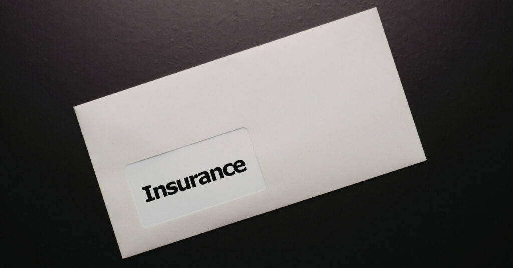 Envelope labeled insurance symbolizing private health insurance options for foreigners living in indonesia.